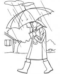 Осень, мальчик идет под зонтиком в дождь 
